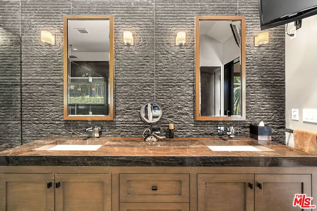 bathroom with vanity and backsplash