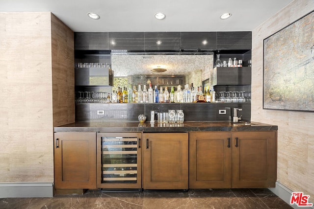 bar with sink and wine cooler