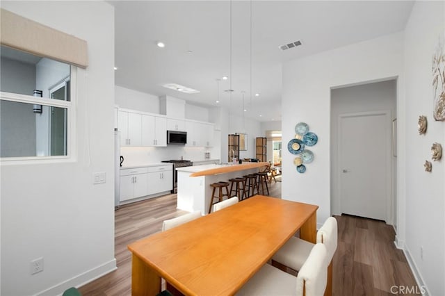 dining room featuring light hardwood / wood-style floors