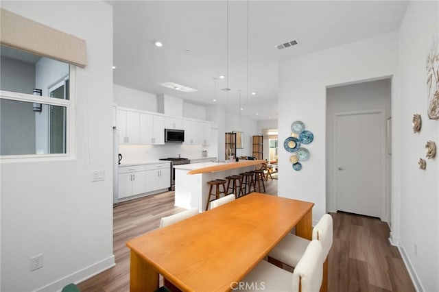 dining area with light wood-type flooring