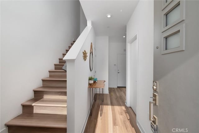 stairs with wood-type flooring