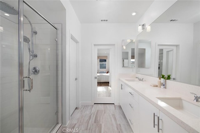 bathroom with vanity and walk in shower