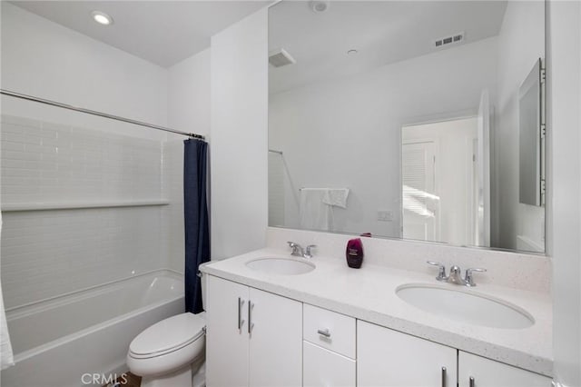 full bathroom featuring toilet, vanity, and shower / bathtub combination with curtain