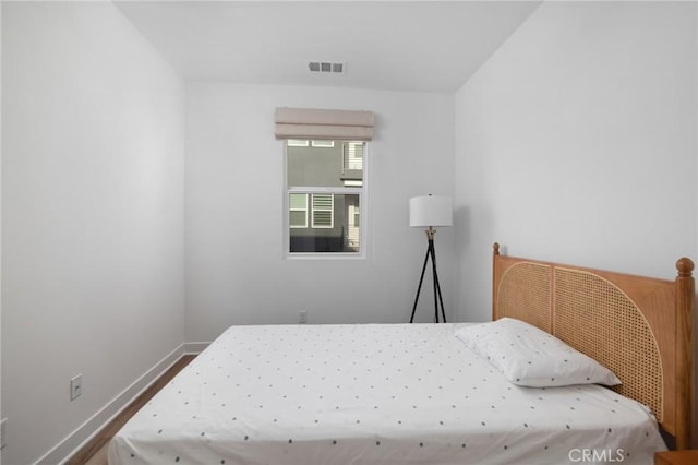 bedroom with wood-type flooring