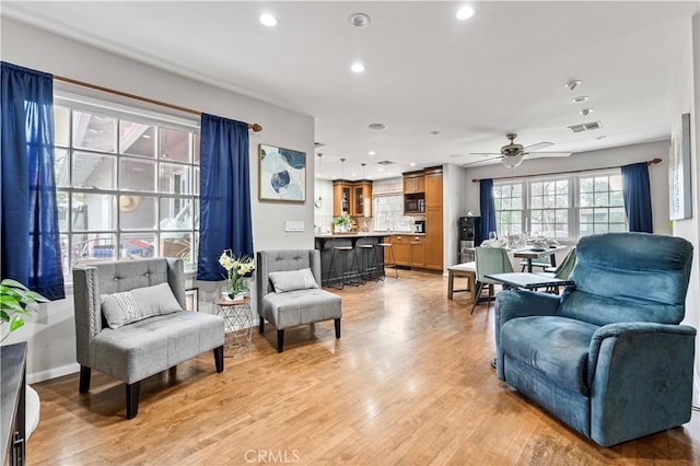 431 Preciado St, Pomona, CA 91768 - living area featuring visible vents, baseboards, a ceiling fan, light wood-style flooring, and recessed lighting