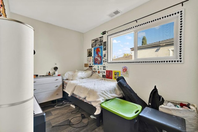 bedroom featuring dark hardwood / wood-style floors