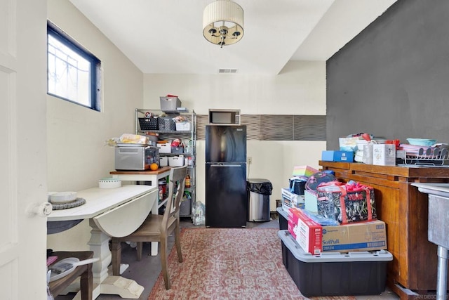 kitchen featuring black fridge