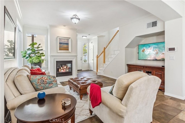 living room featuring crown molding