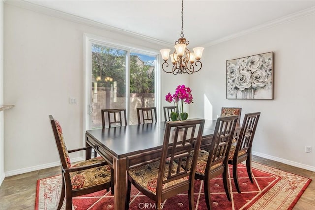 tiled dining area featuring ornamental molding and a notable chandelier