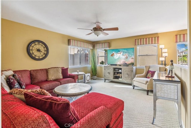 living room featuring light carpet and ceiling fan