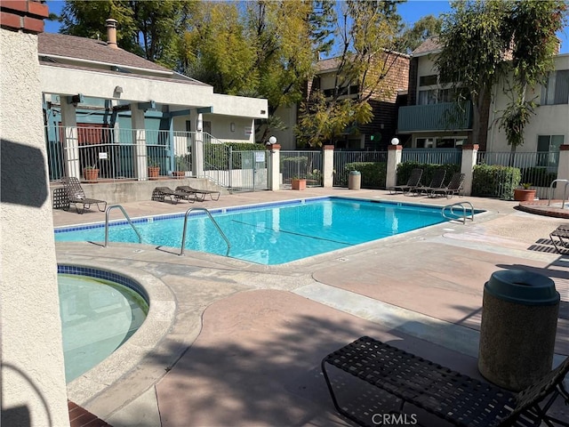 view of swimming pool with a patio