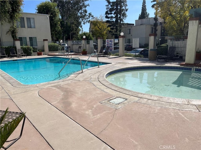 view of swimming pool with a patio area