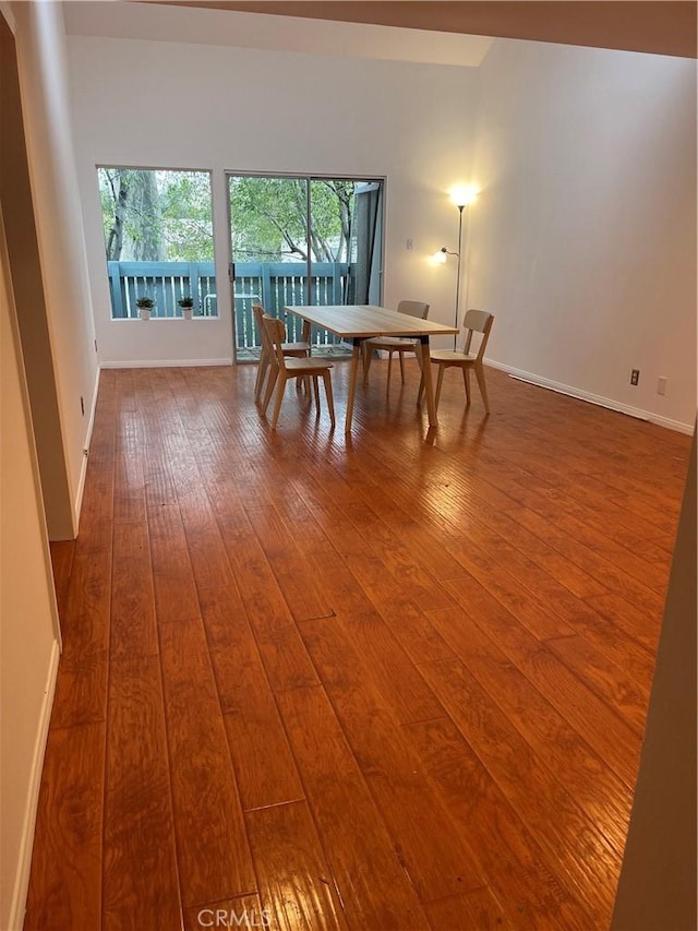 unfurnished dining area with wood-type flooring