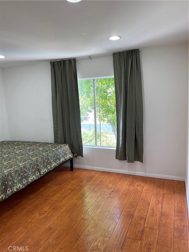 bedroom featuring wood-type flooring