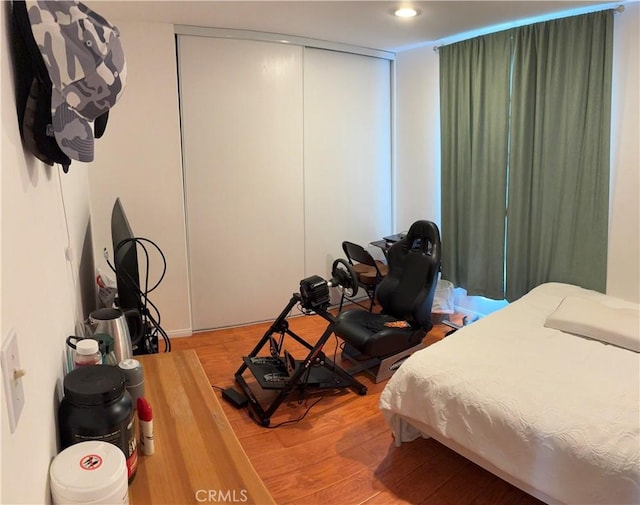 bedroom featuring hardwood / wood-style flooring and a closet