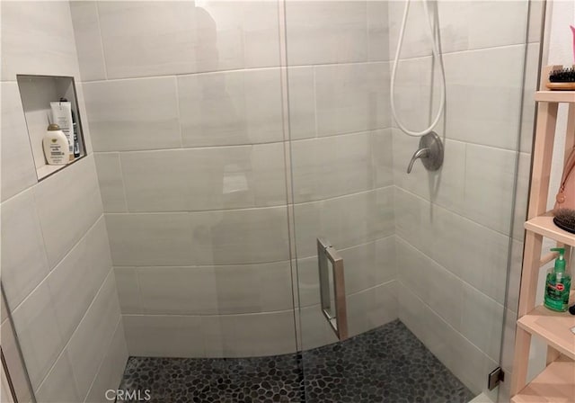 bathroom featuring an enclosed shower