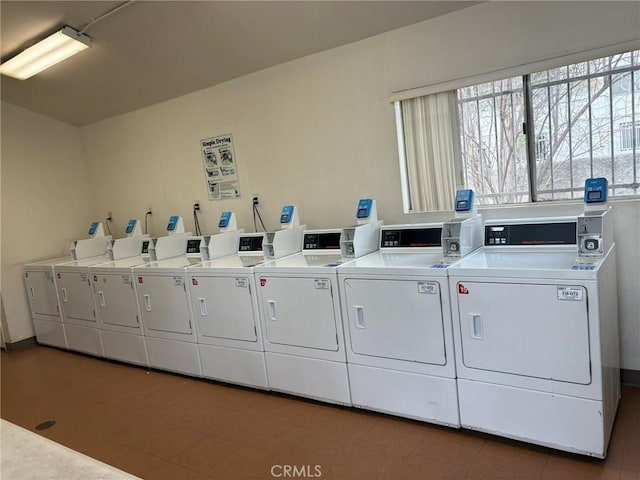 clothes washing area featuring separate washer and dryer