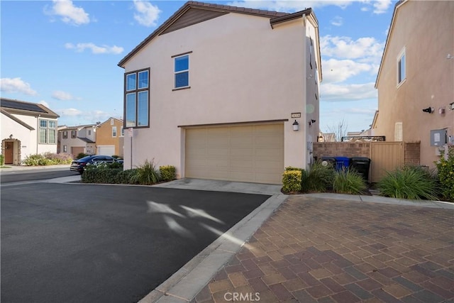 view of side of property featuring a garage