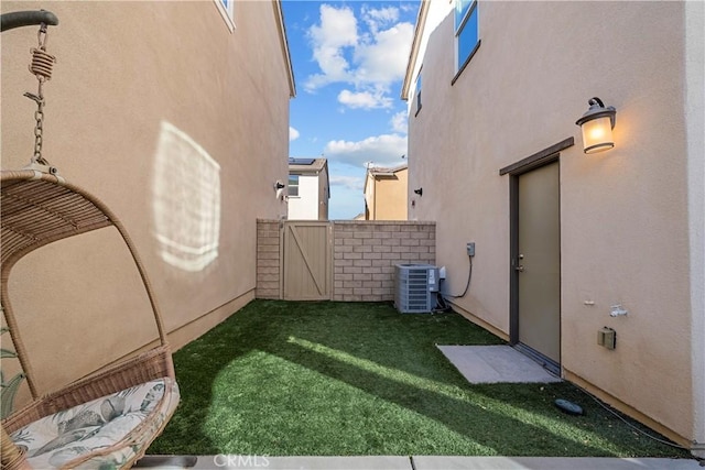 view of yard with central AC unit