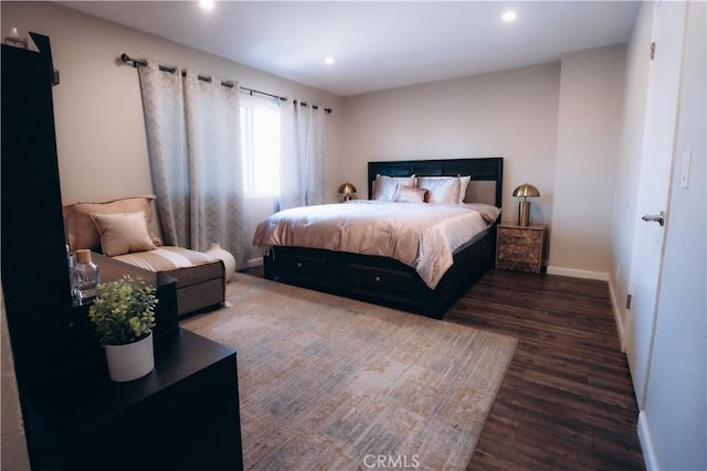 bedroom with dark wood-type flooring