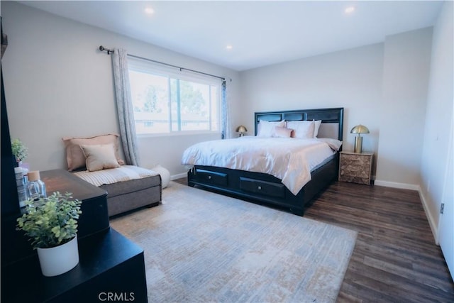 bedroom featuring dark hardwood / wood-style flooring