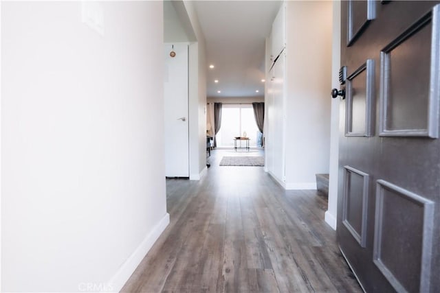 corridor featuring hardwood / wood-style floors