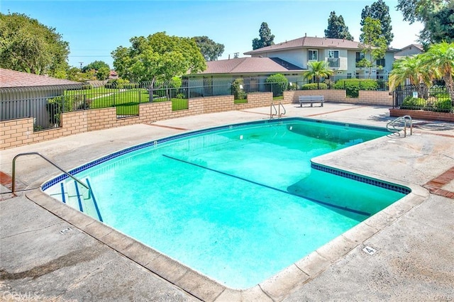 view of swimming pool with a patio area