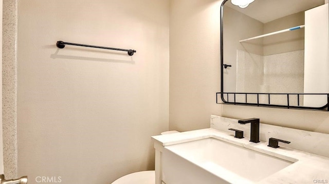 bathroom featuring sink and toilet