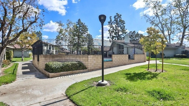 view of home's community featuring a lawn