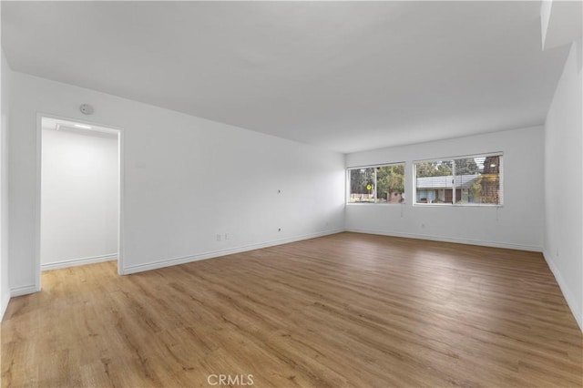 unfurnished room with light hardwood / wood-style flooring