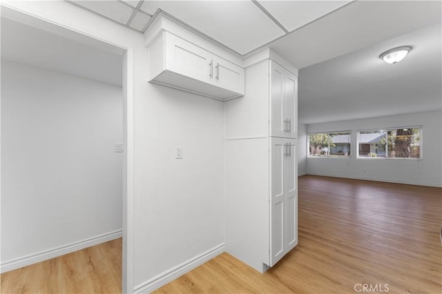 kitchen featuring white cabinetry and light hardwood / wood-style floors