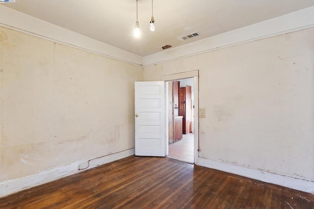 spare room featuring hardwood / wood-style flooring