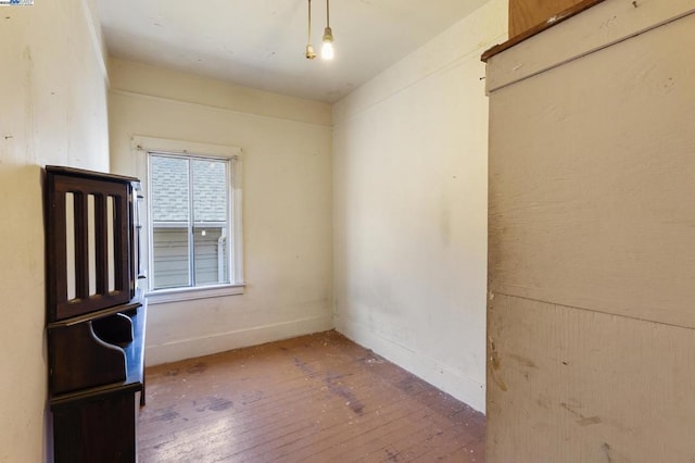 unfurnished room featuring hardwood / wood-style floors