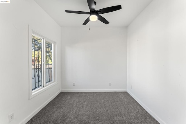 carpeted empty room featuring ceiling fan