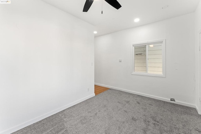 carpeted empty room with ceiling fan