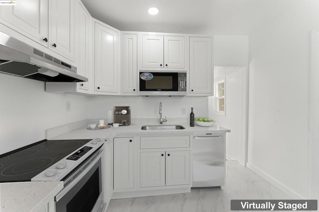 kitchen featuring white cabinetry, sink, and stainless steel appliances