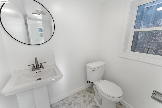 bathroom featuring toilet and sink