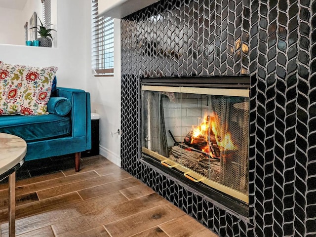 interior space with a tile fireplace