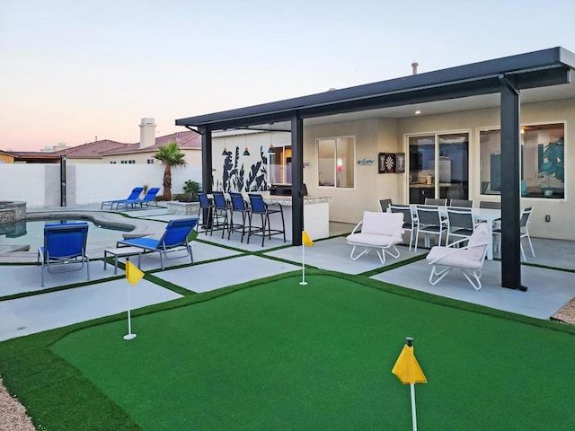 view of home's community featuring a pool and a patio