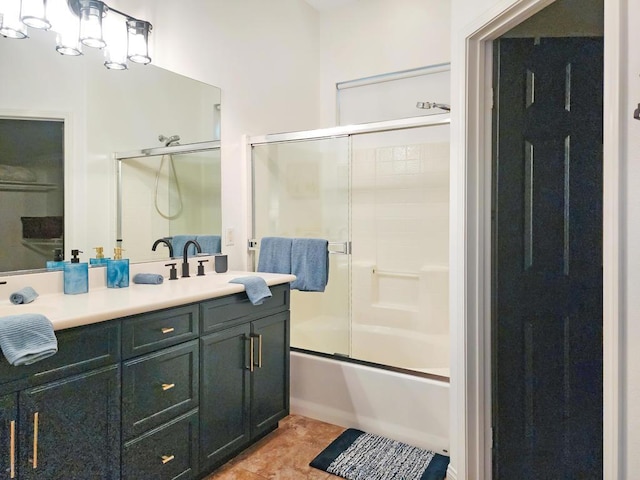 bathroom with enclosed tub / shower combo and vanity