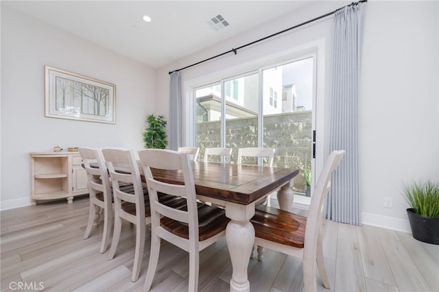 dining room with light wood-type flooring