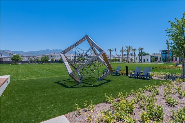 view of playground with a mountain view