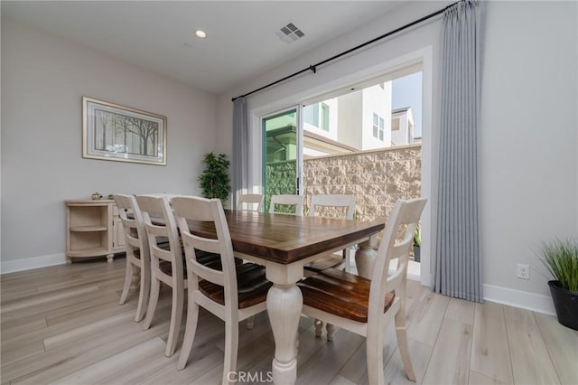 dining space featuring light hardwood / wood-style flooring