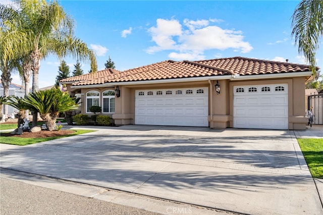 mediterranean / spanish home featuring a garage