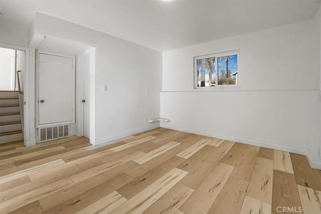 spare room with light wood-type flooring