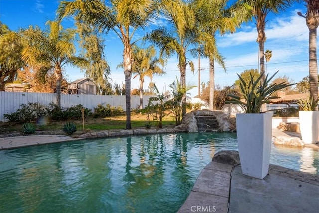 view of swimming pool featuring pool water feature