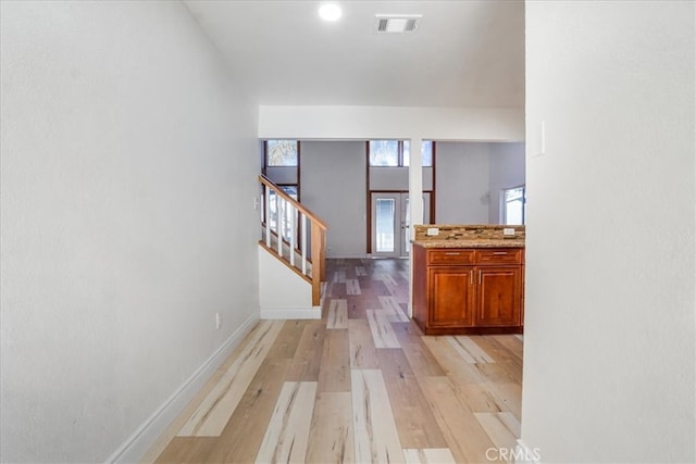 hallway featuring light wood-type flooring