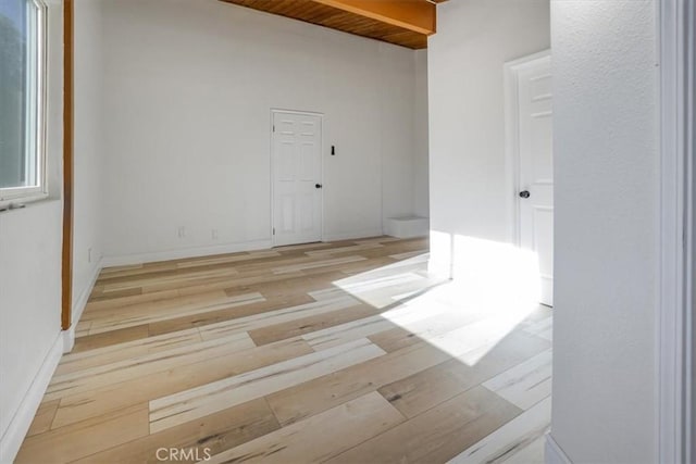 spare room with wooden ceiling and light hardwood / wood-style flooring