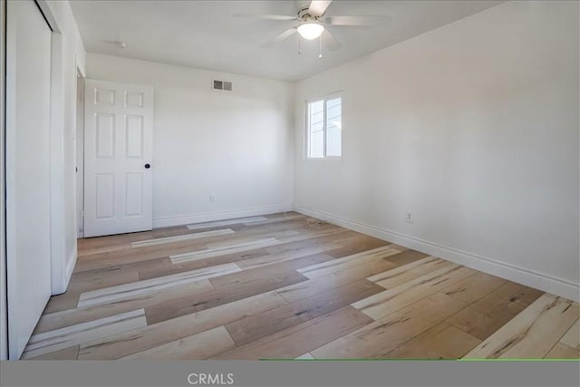 unfurnished room featuring ceiling fan and light hardwood / wood-style floors