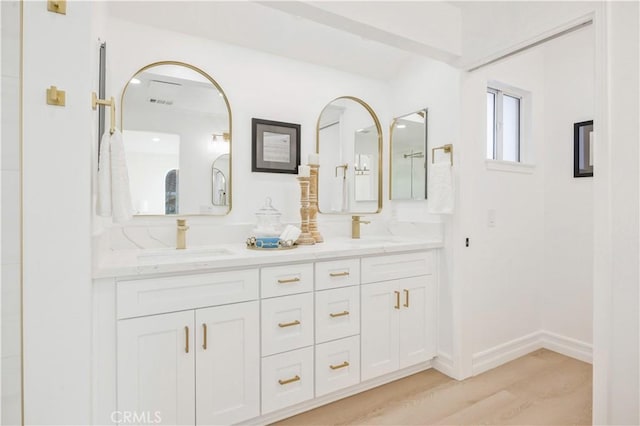 bathroom featuring hardwood / wood-style flooring and vanity